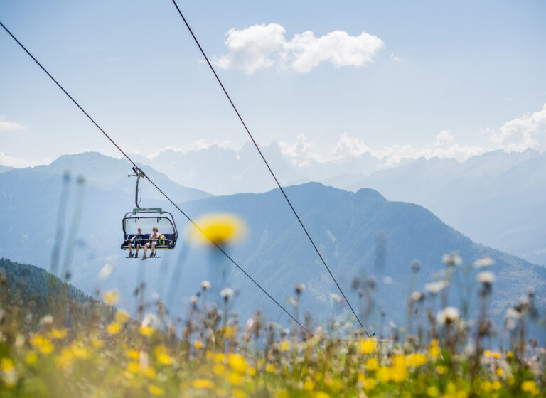 Hikers on chairlift in Predazzo